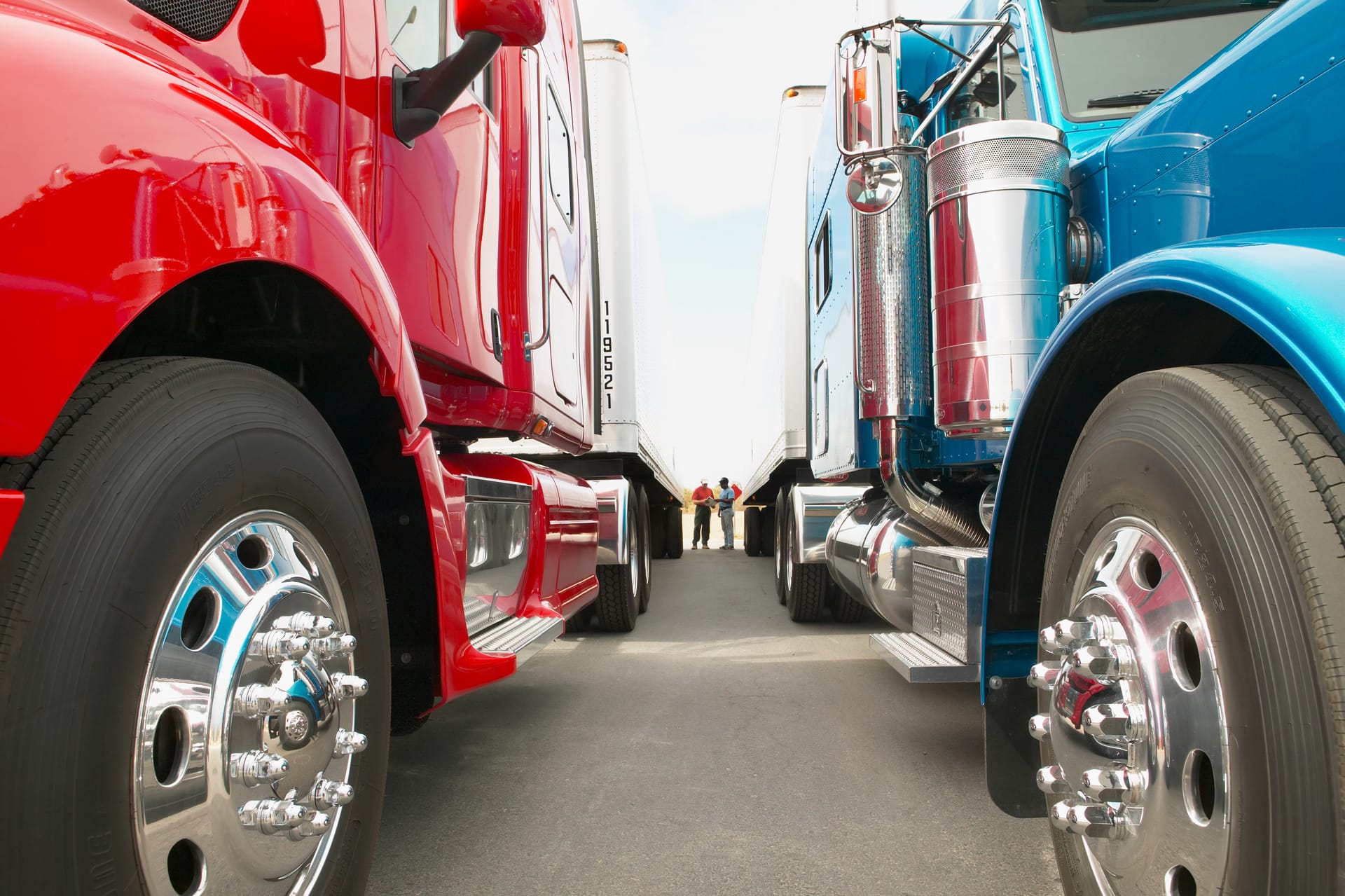 Truck drivers discussing operations between vehicles